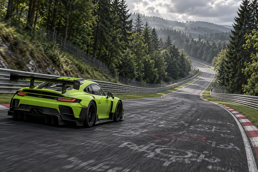 Lime-green GT racing car on a quiet Nordschleife qualifying lap.