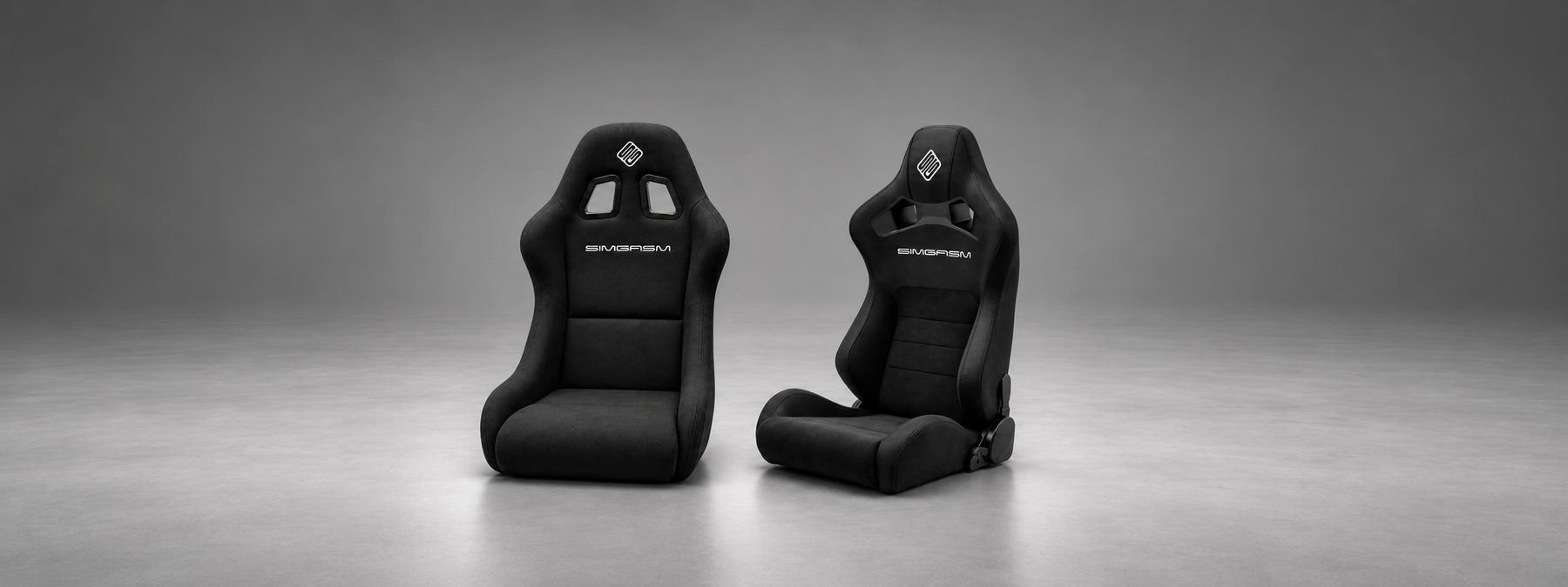 Black SIMGASM Core Bucket and Core Recline seats side by side, showing their different backrest shapes and upholstery.