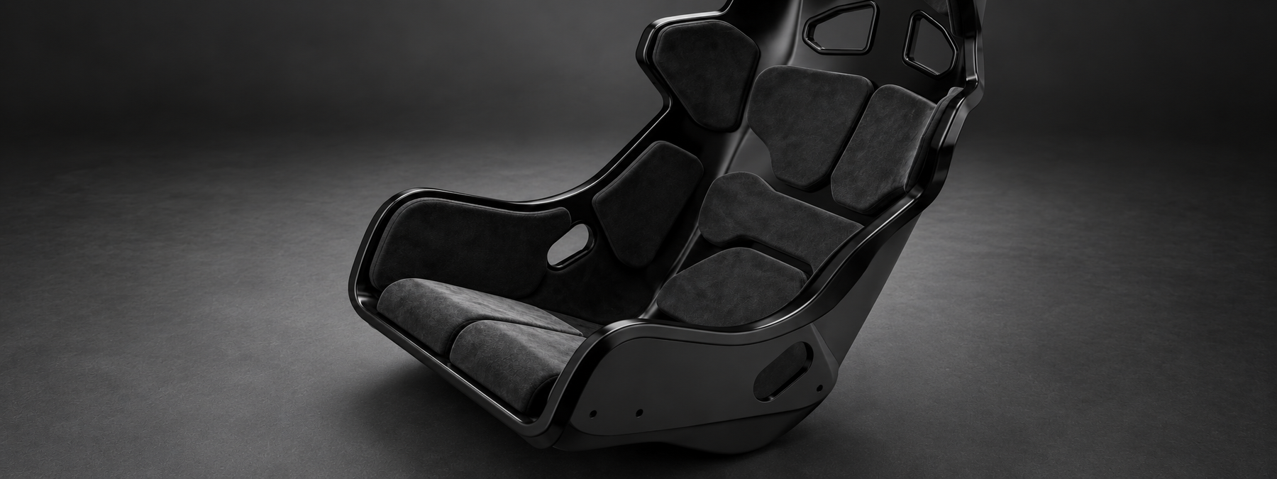 Close-up of the SIMGASM Atlas GT seat showing shaped hip bolsters and removable support cushions