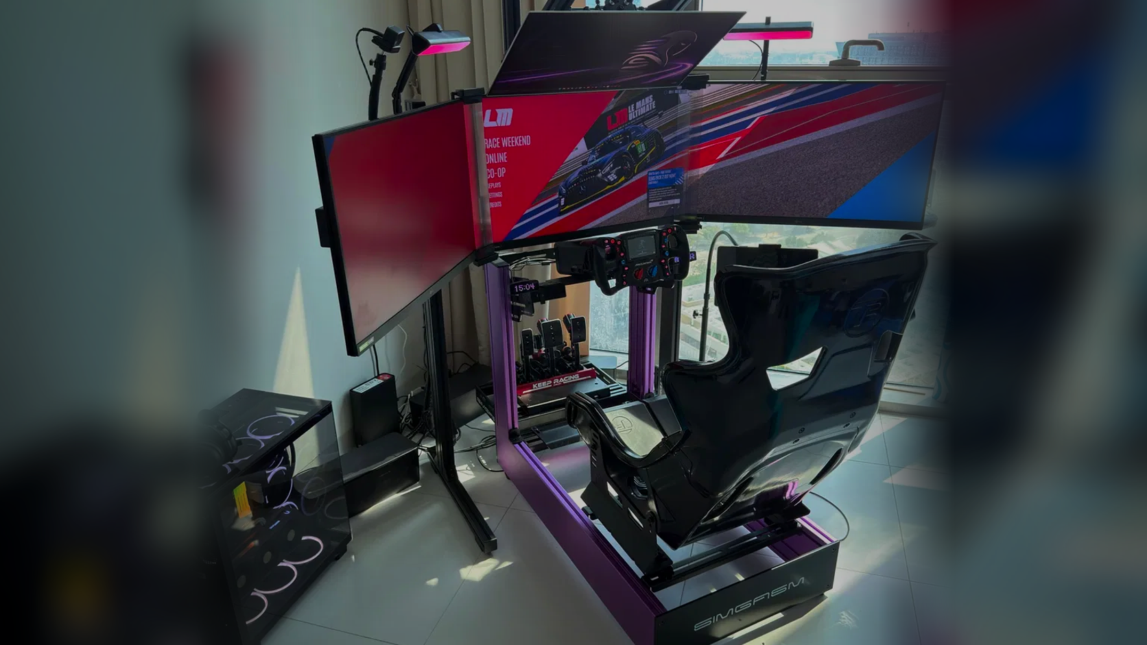 Authentic SIMGASM multi-monitor sim racing cockpit configured for streaming and content creation.