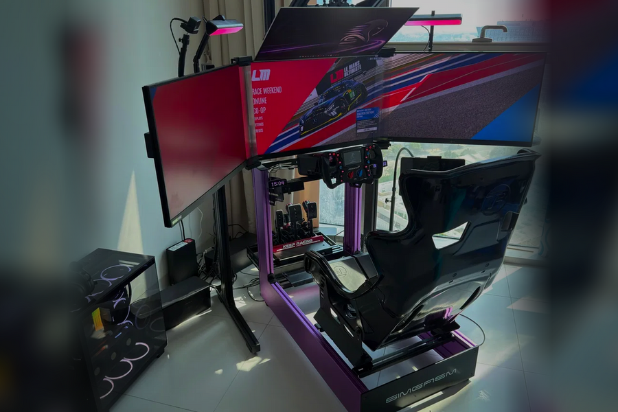 Authentic SIMGASM multi-monitor sim racing cockpit configured for streaming and content creation.